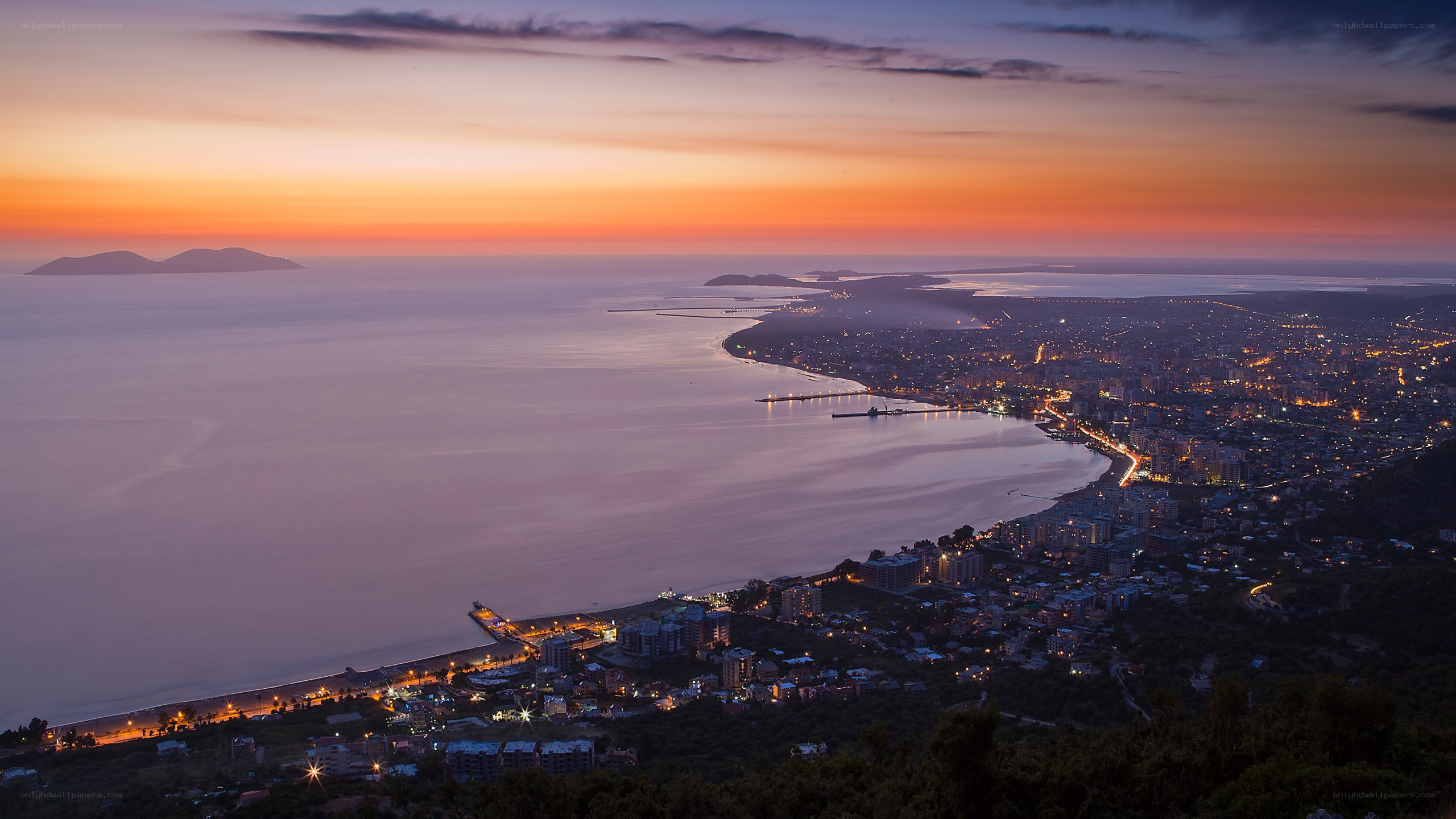 Sunset over coastal city