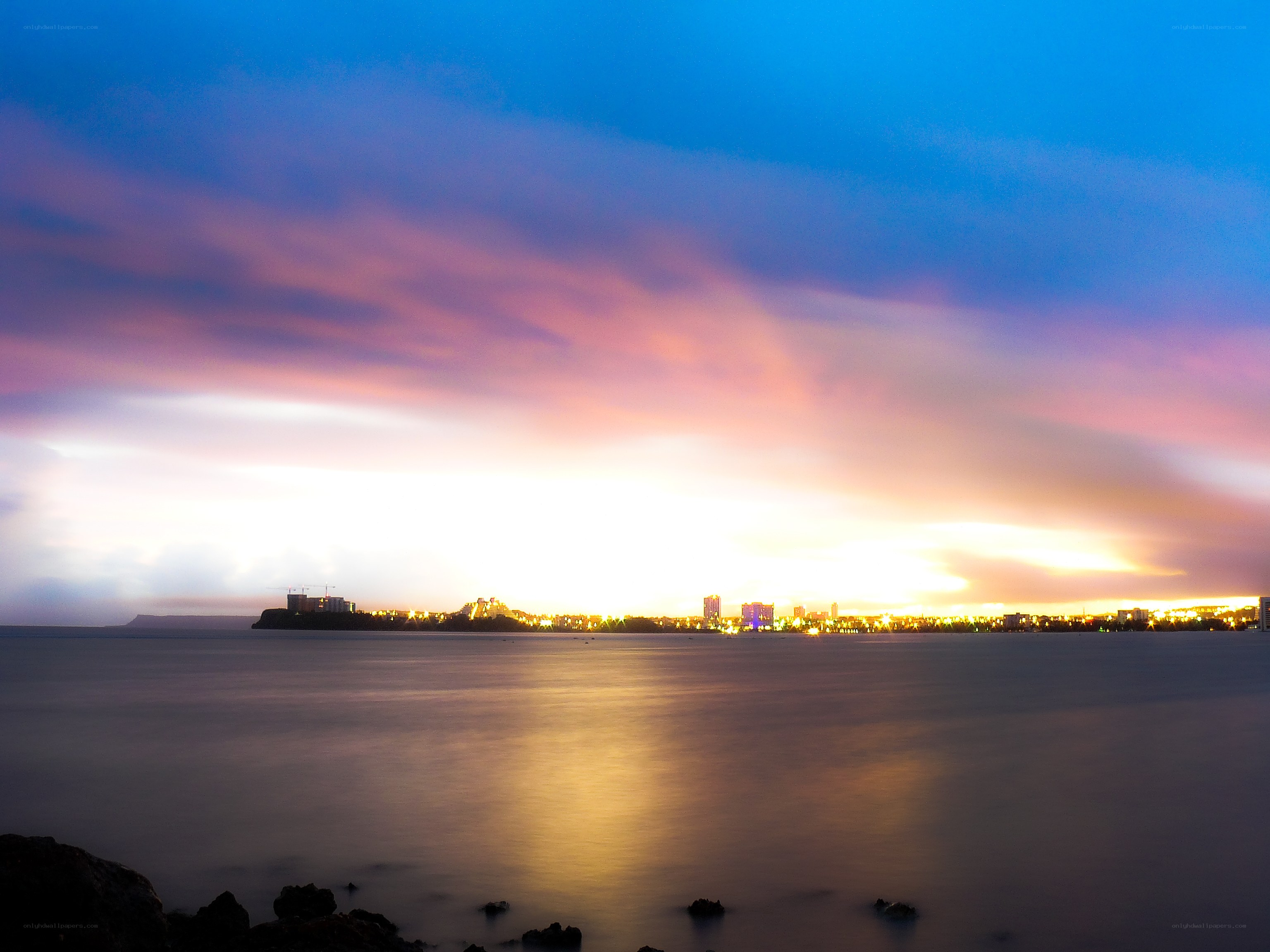 sunset over coastal city