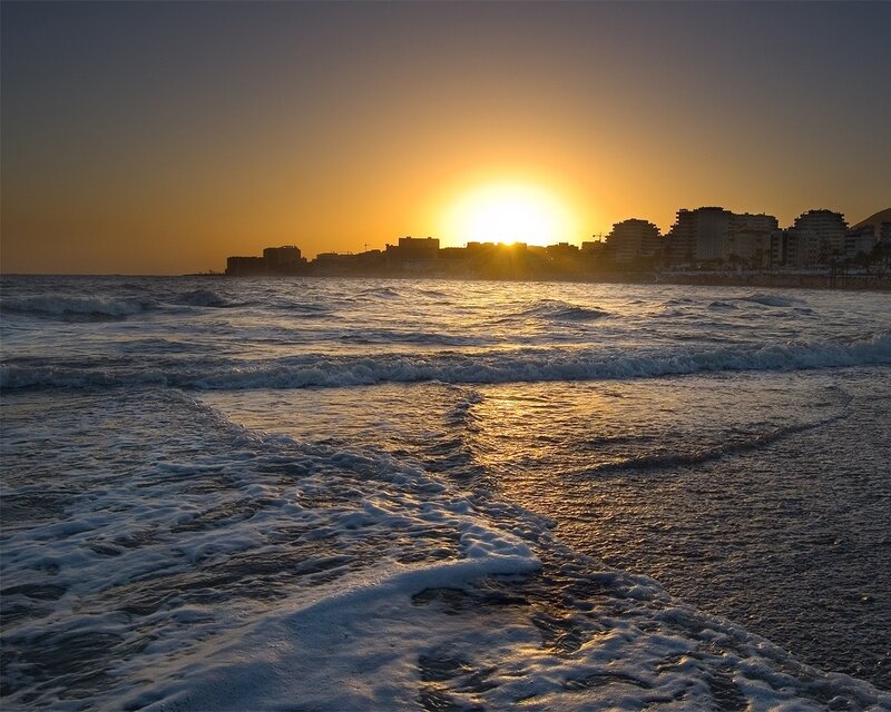 Sunset over coastal city