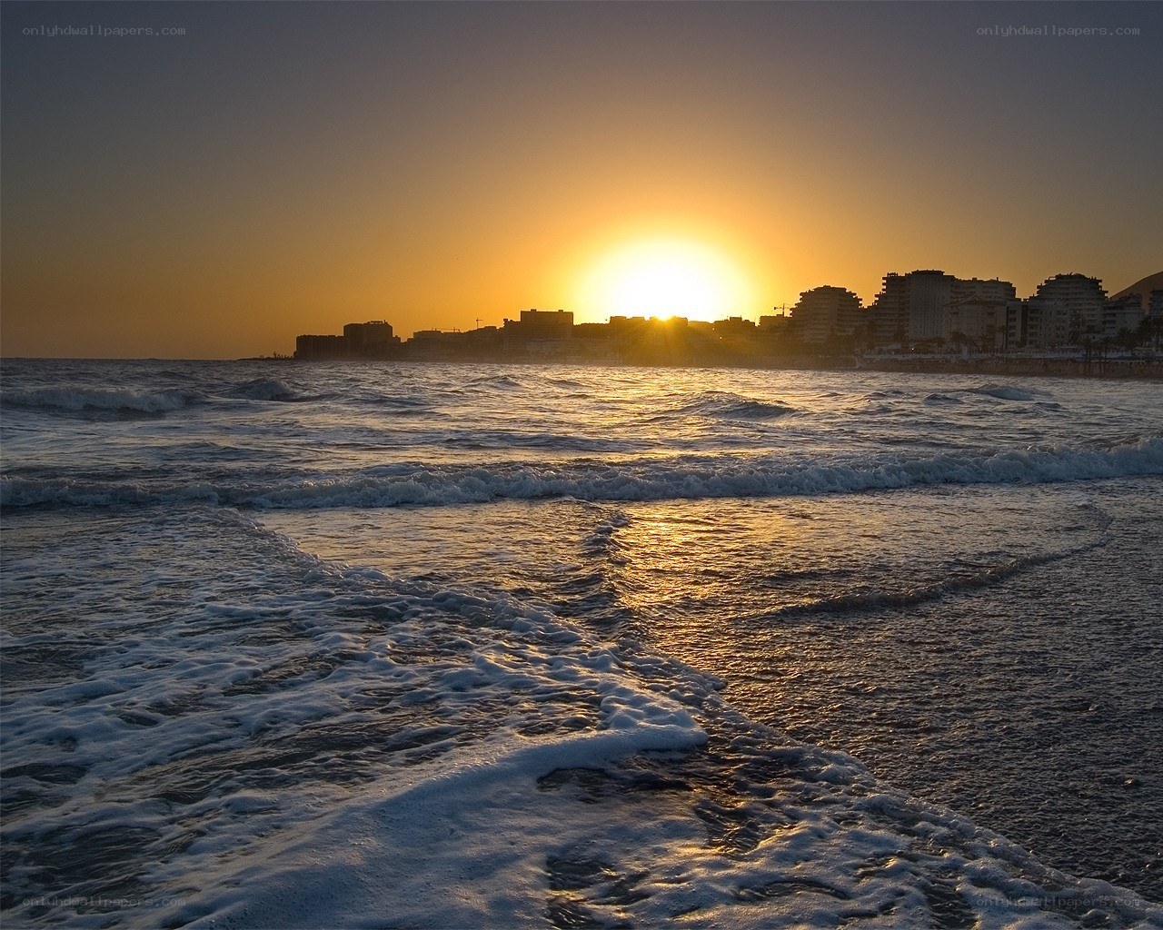 Sunset over coastal city
