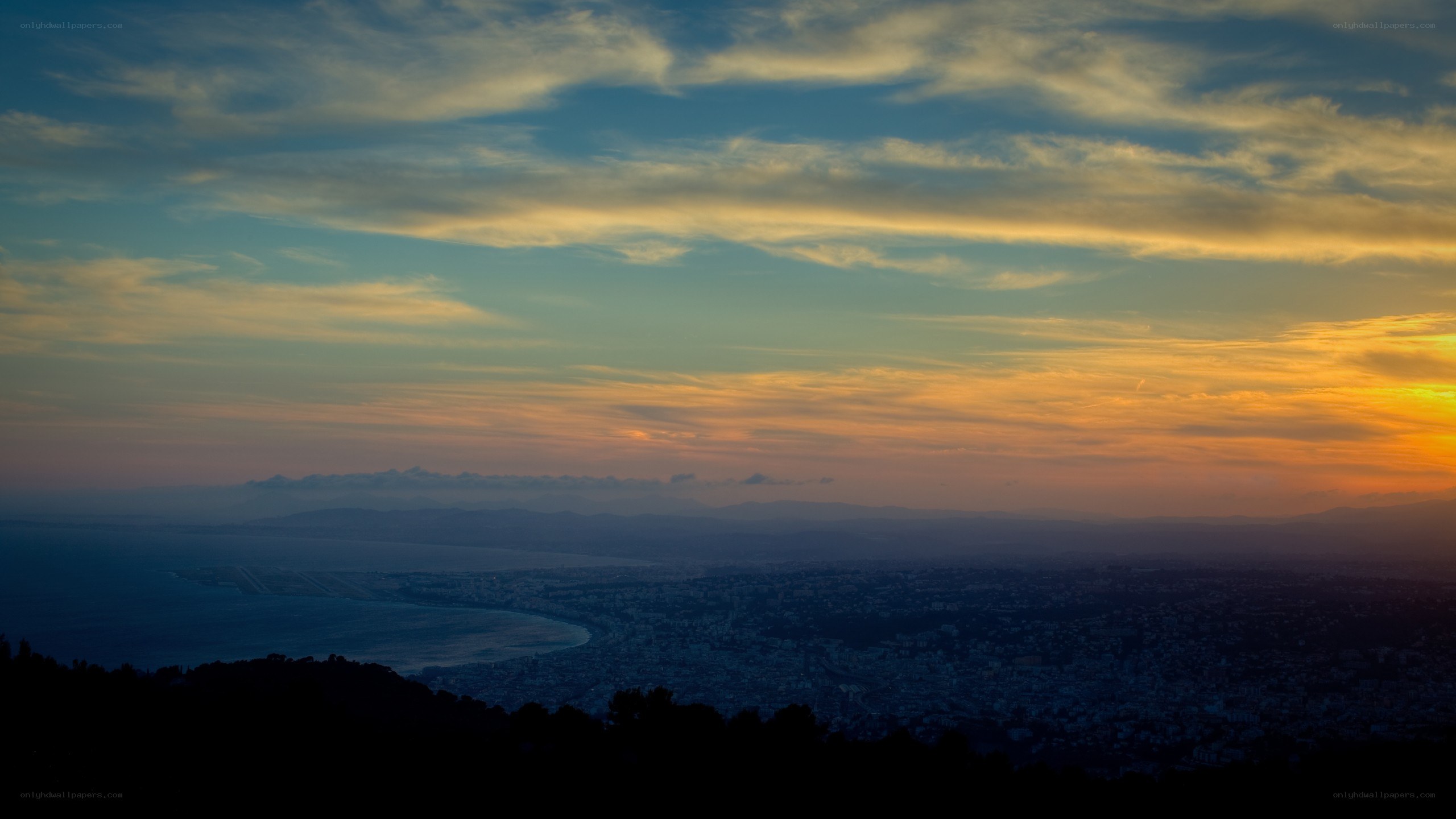 sunset over coastal city