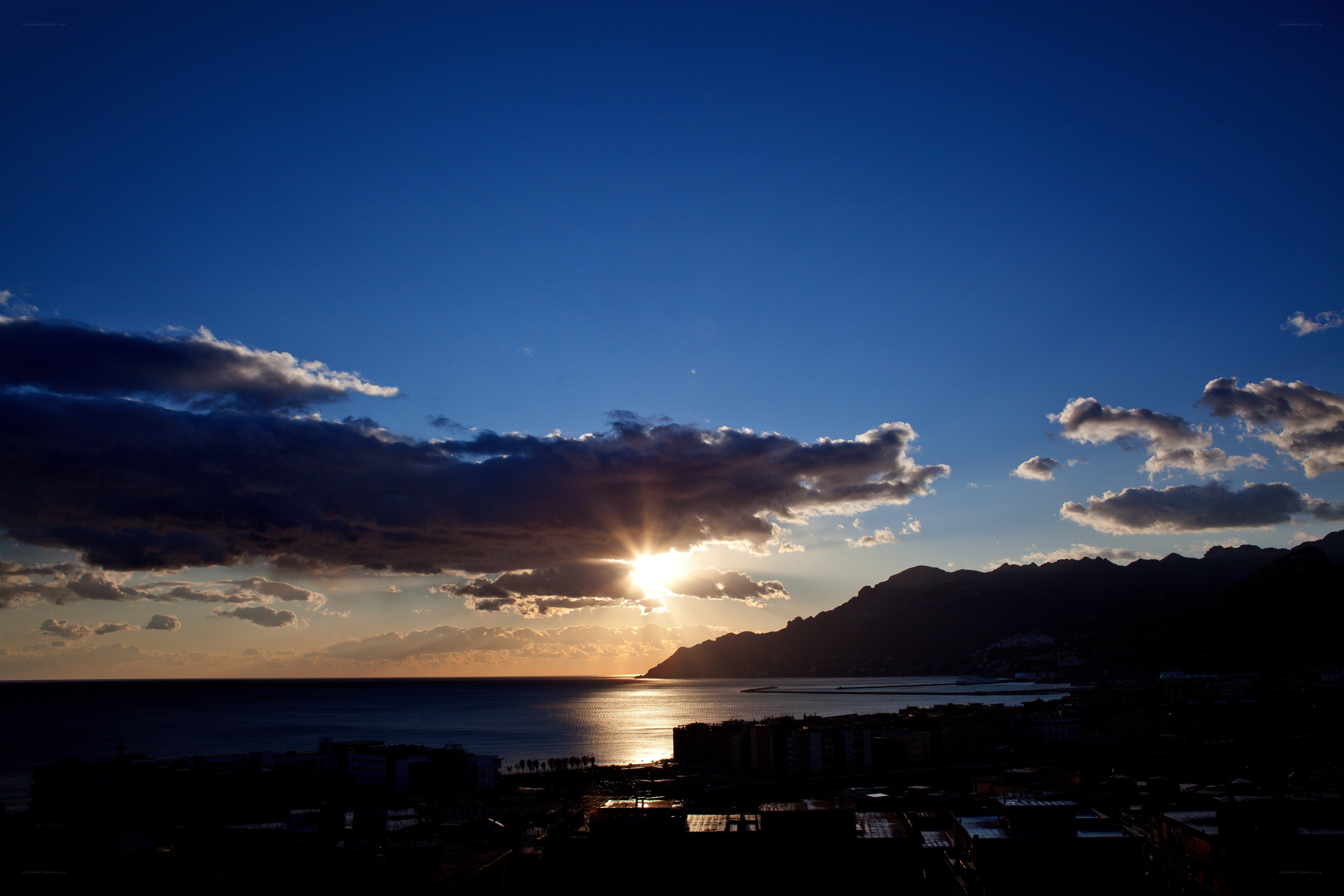 Sunset over coastal city