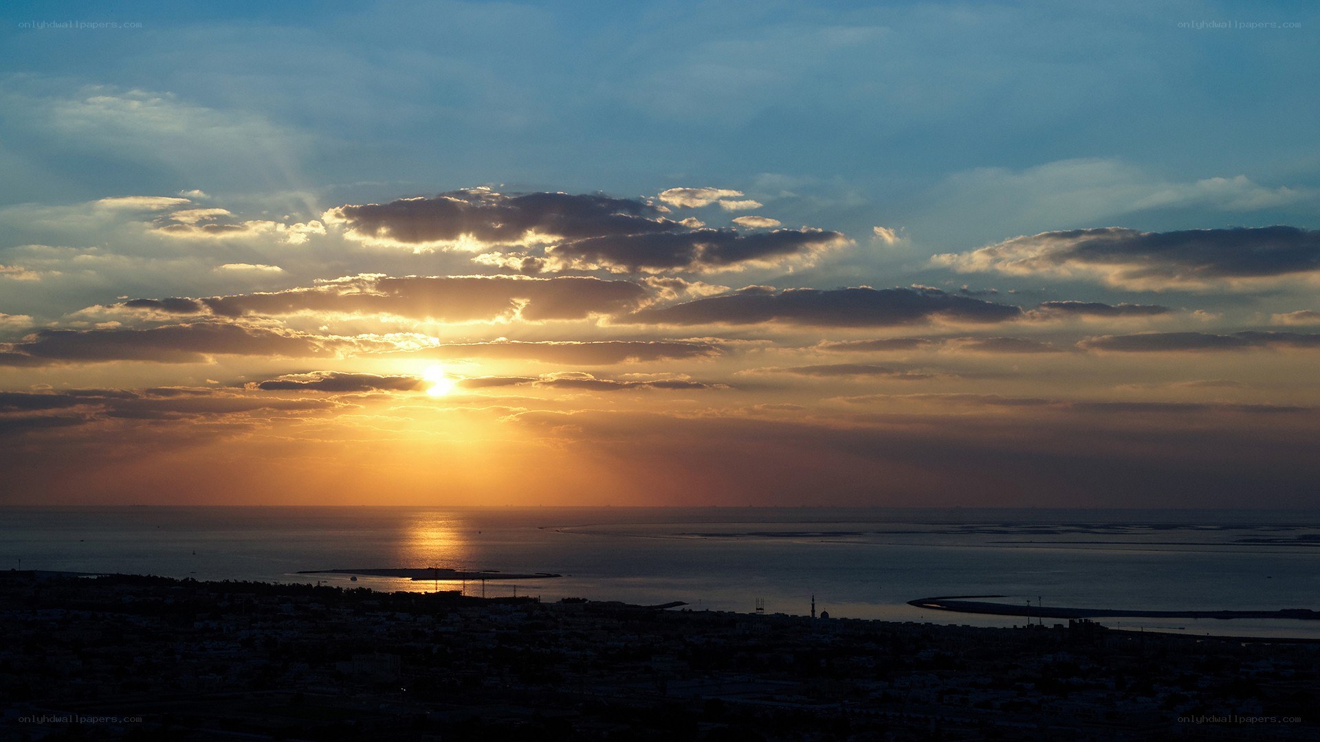 sunset over coastal city