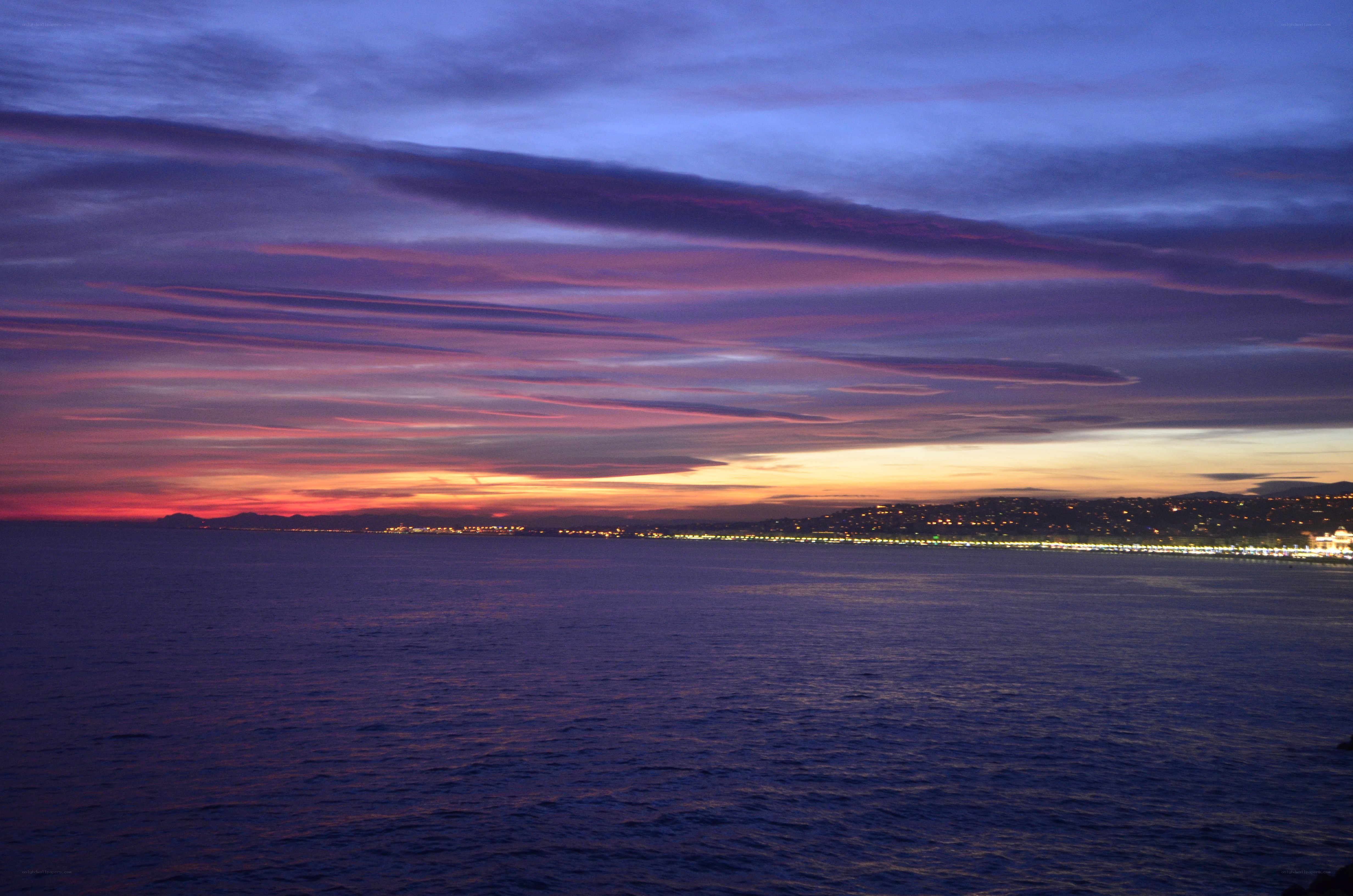 sunset over coastal city
