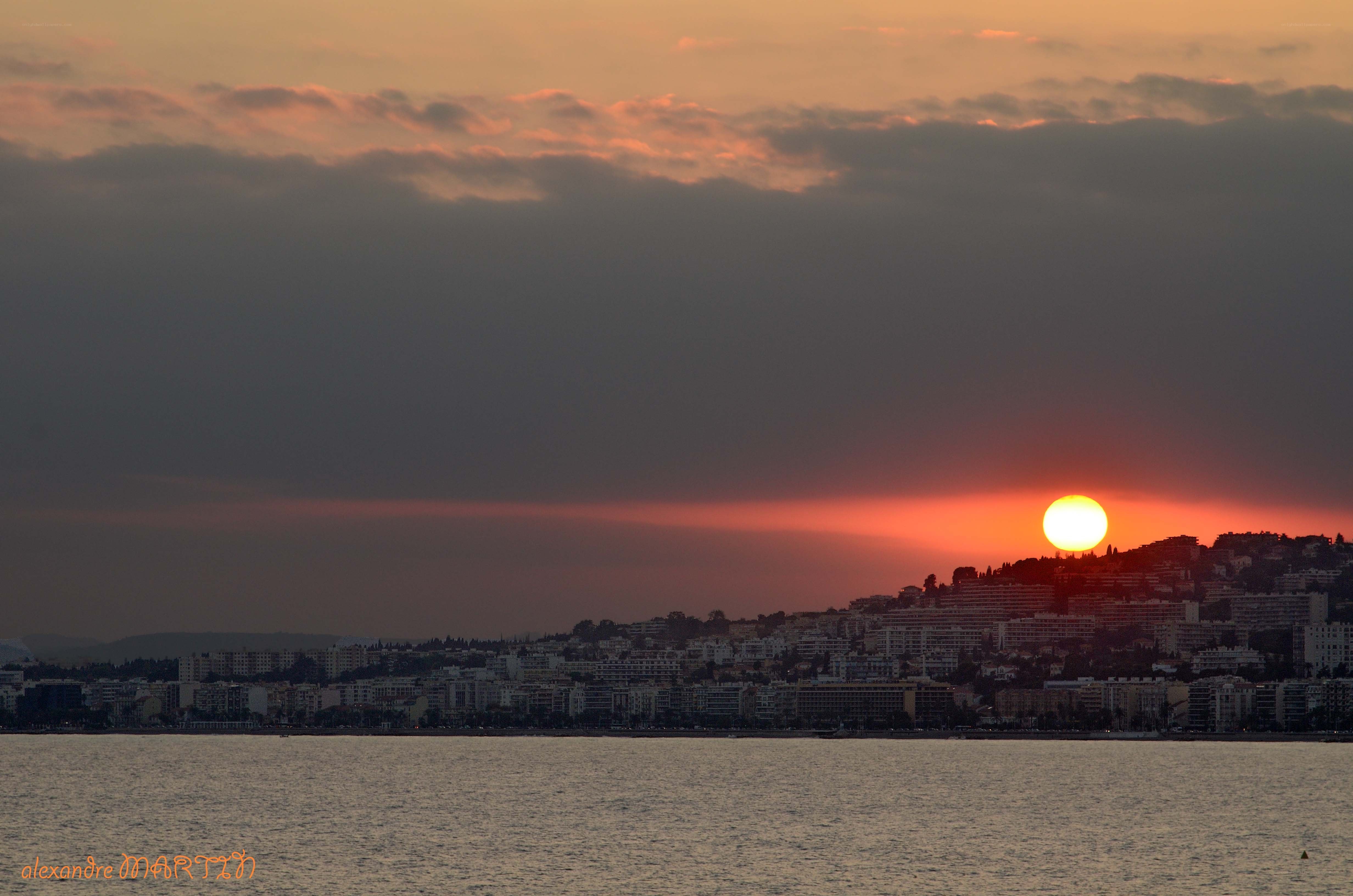 Sunset over coastal city