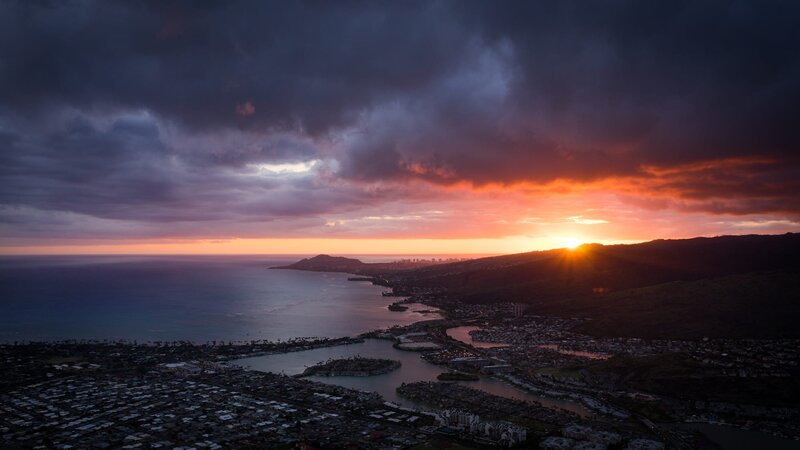Sunset over Coastal City — Orange, Dramatic, Photograph, Ocean