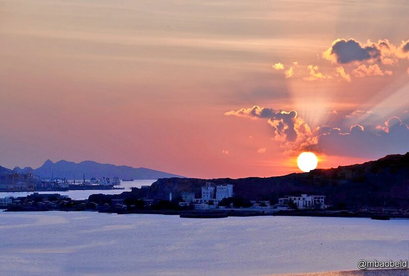 Sunset over Coastal City — Orange