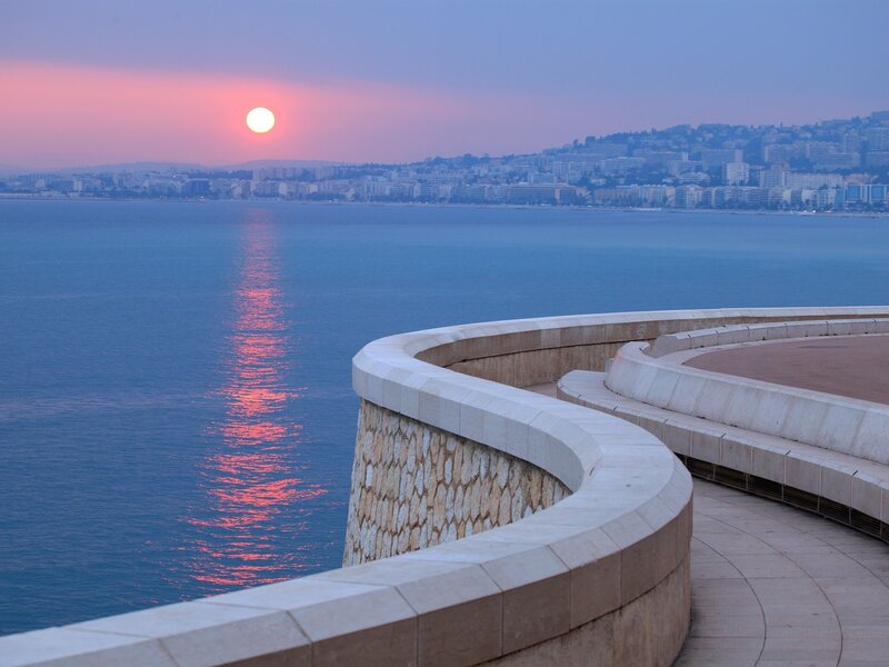 Sunset over Coastal City — Serene