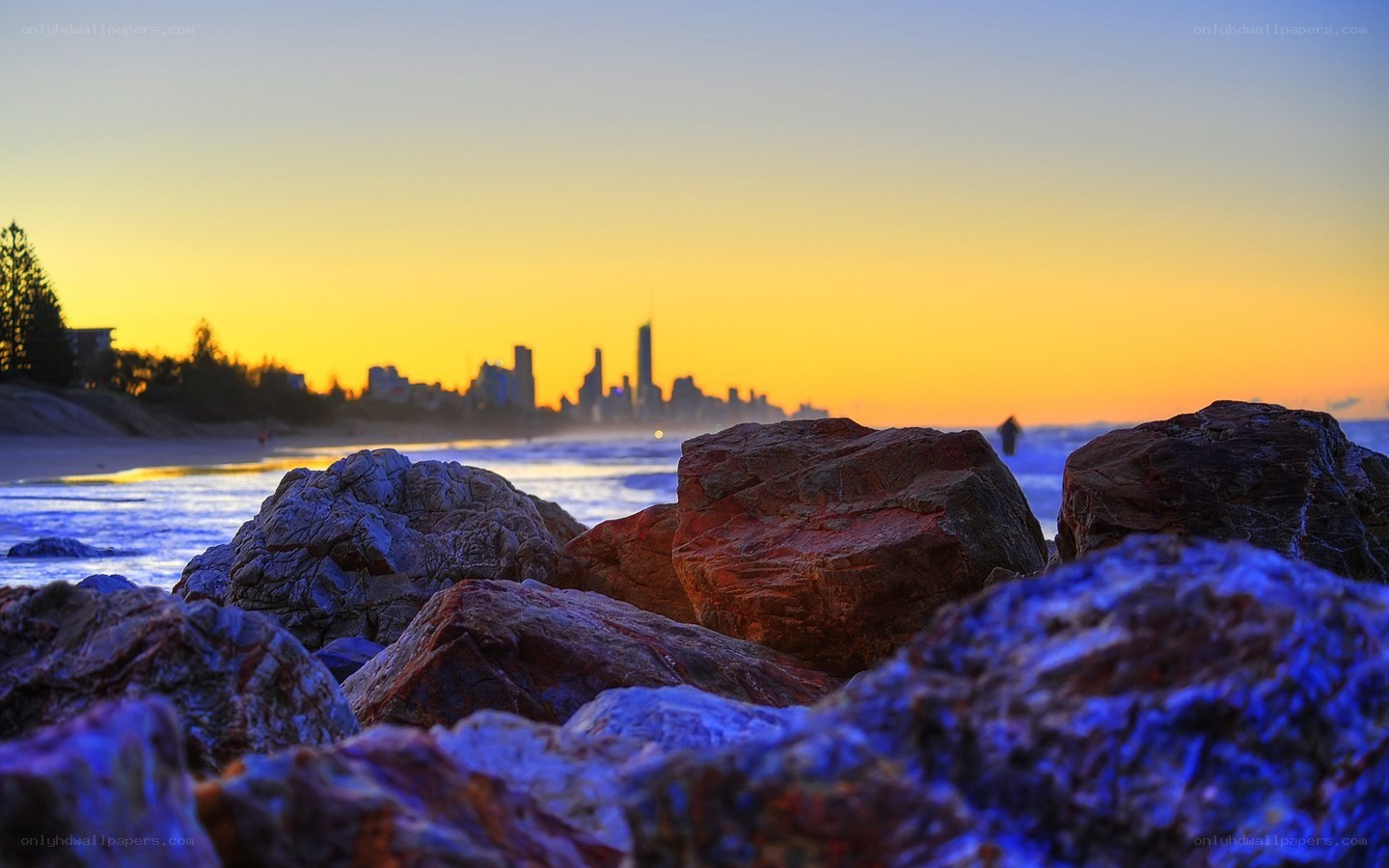 Sunset over coastal city skyline