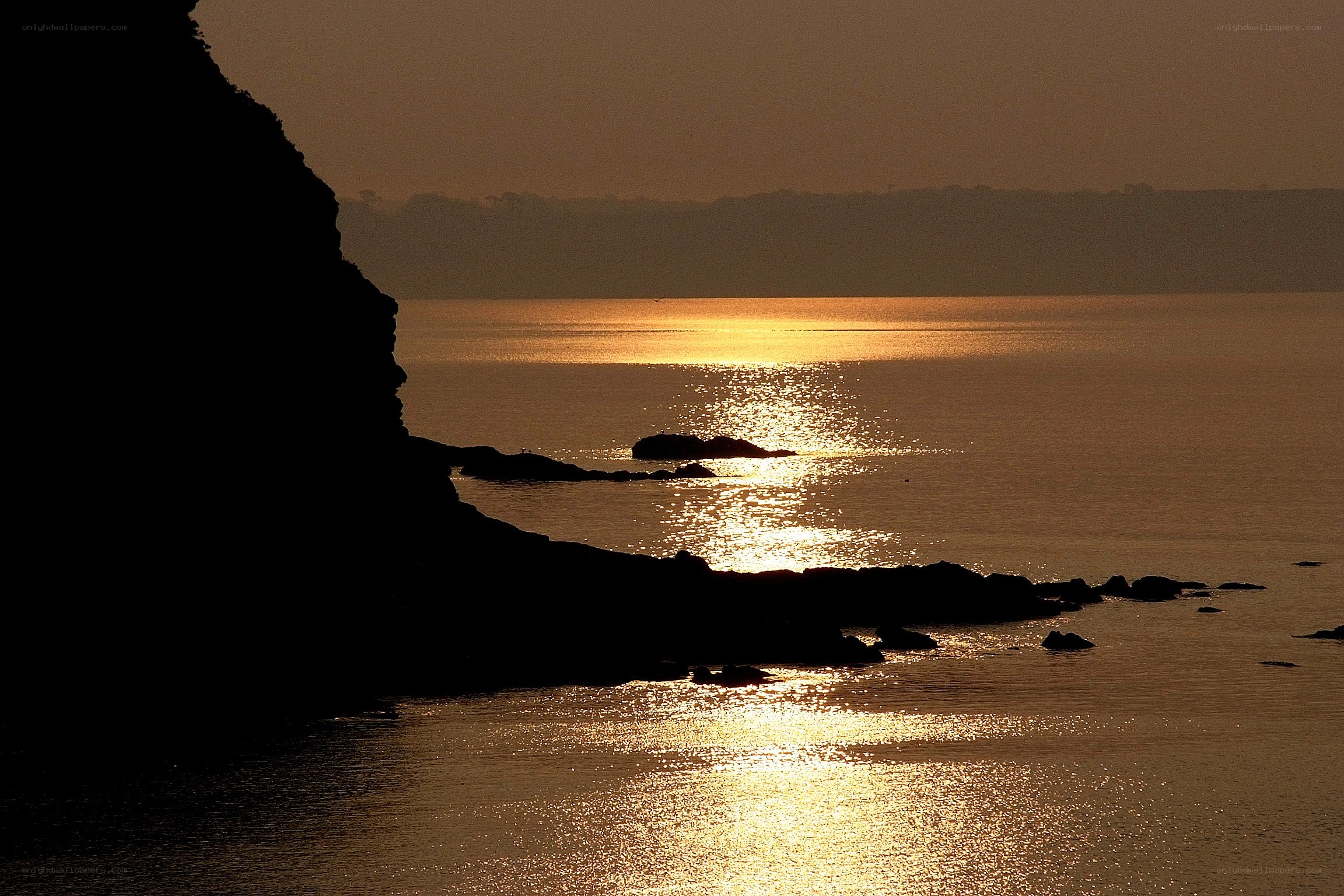 Sunset over coastal cliffs