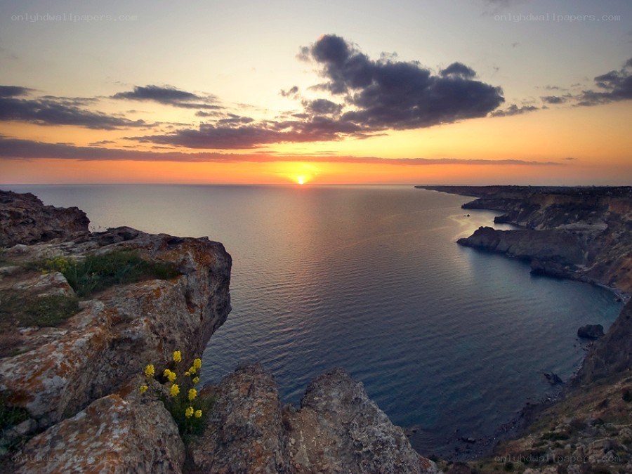 Sunset over coastal cliffs