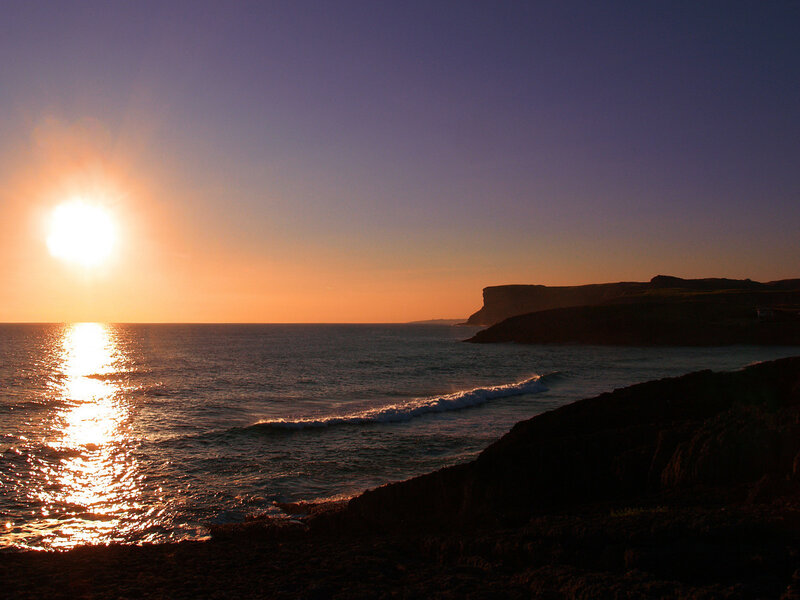 sunset over coastal cliffs