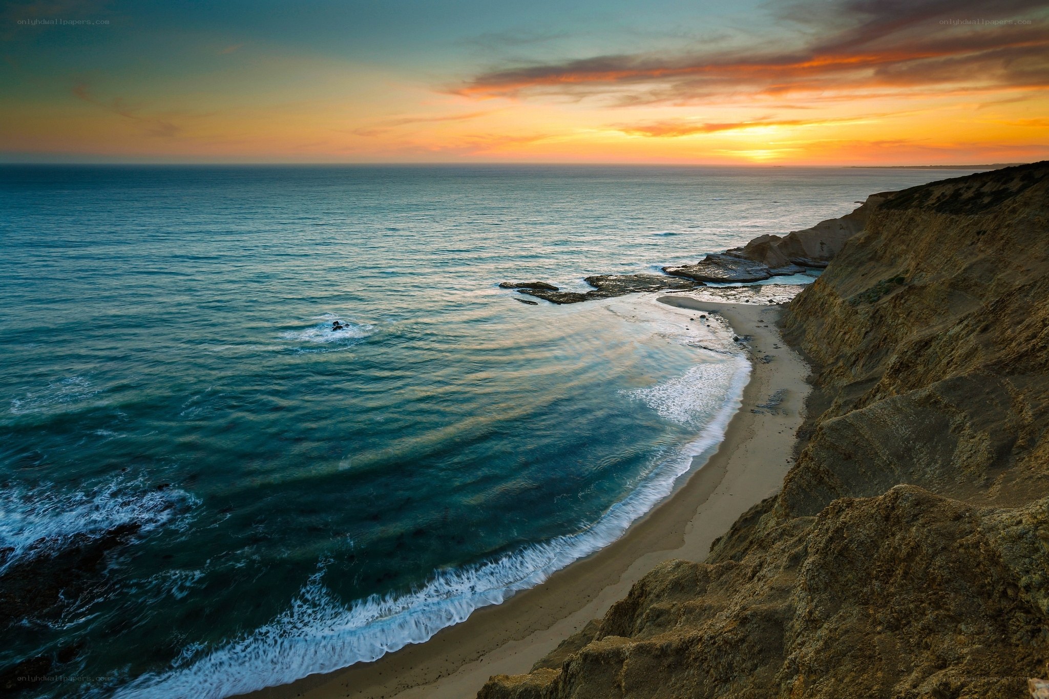 Sunset over coastal cliffs