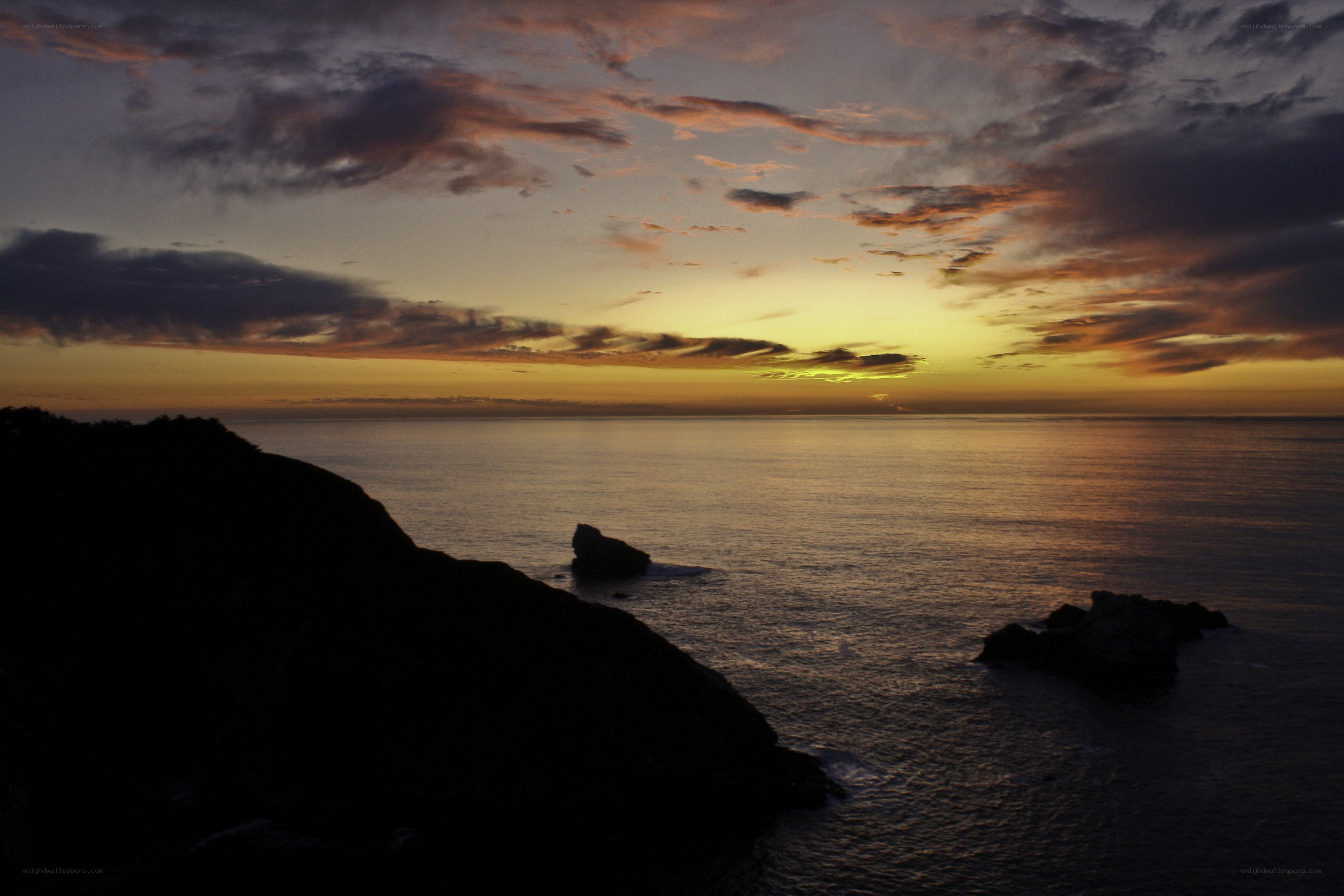 Sunset over coastal cliffs