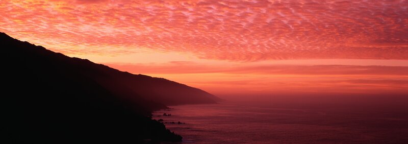 sunset over coastal cliffs