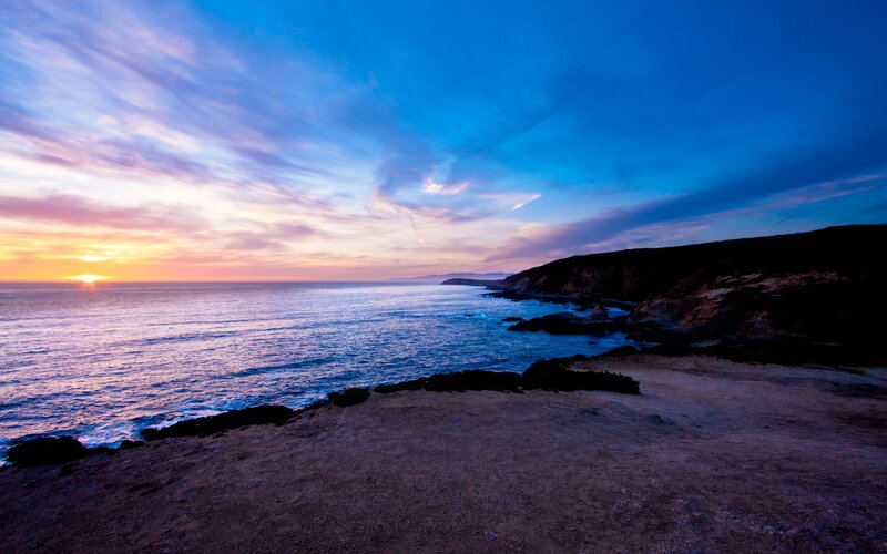 sunset over coastal cliffs