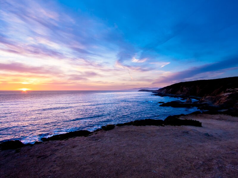 sunset over coastal cliffs