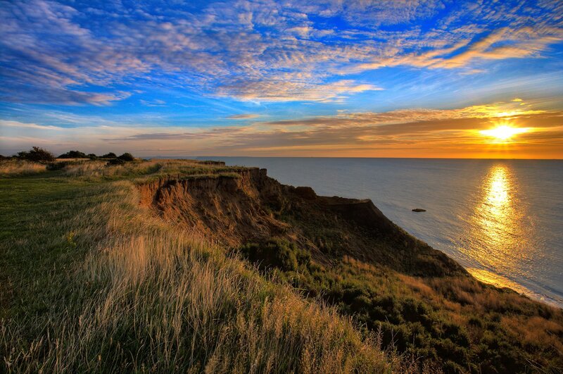Sunset over coastal cliffs
