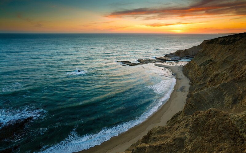 Sunset over coastal cliffs
