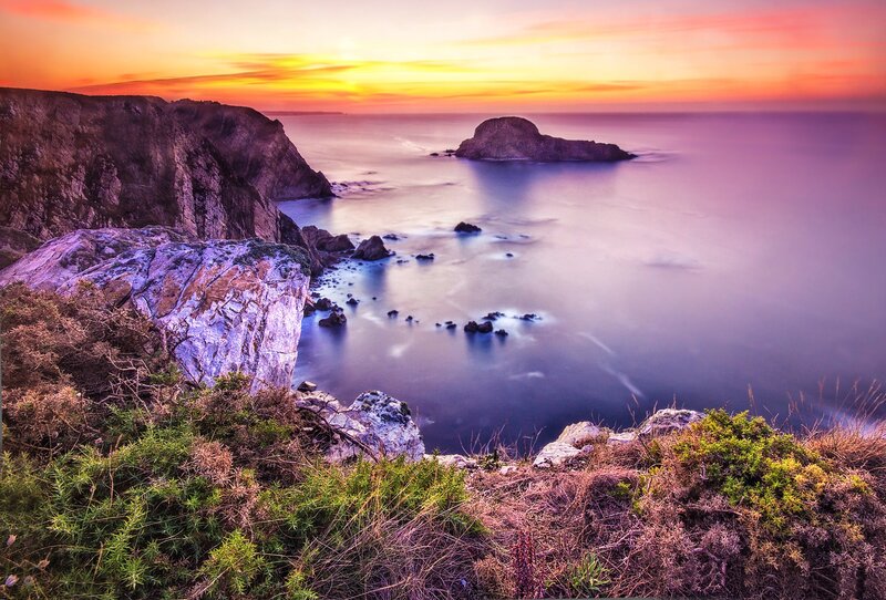 Sunset over coastal cliffs