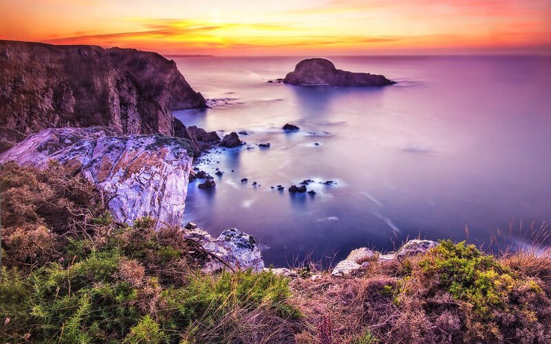 Sunset over coastal cliffs