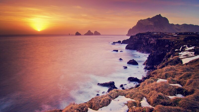 sunset over coastal cliffs