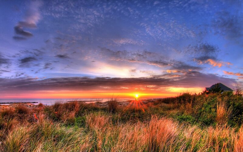 Sunset over coastal dunes