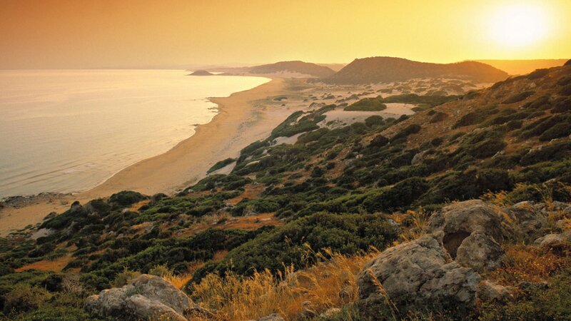 sunset over coastal dunes