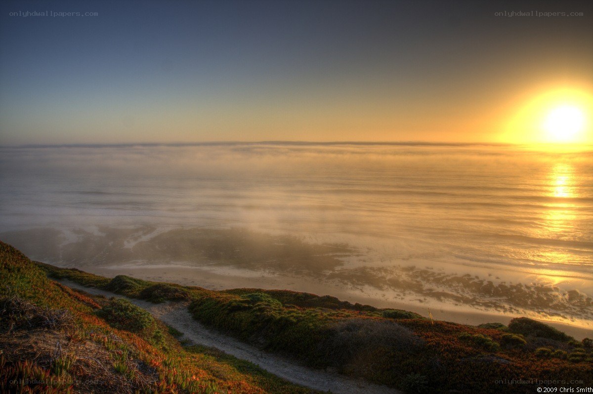 Sunset over coastal fog