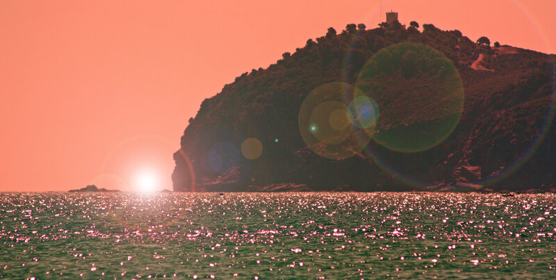 Sunset over coastal hill