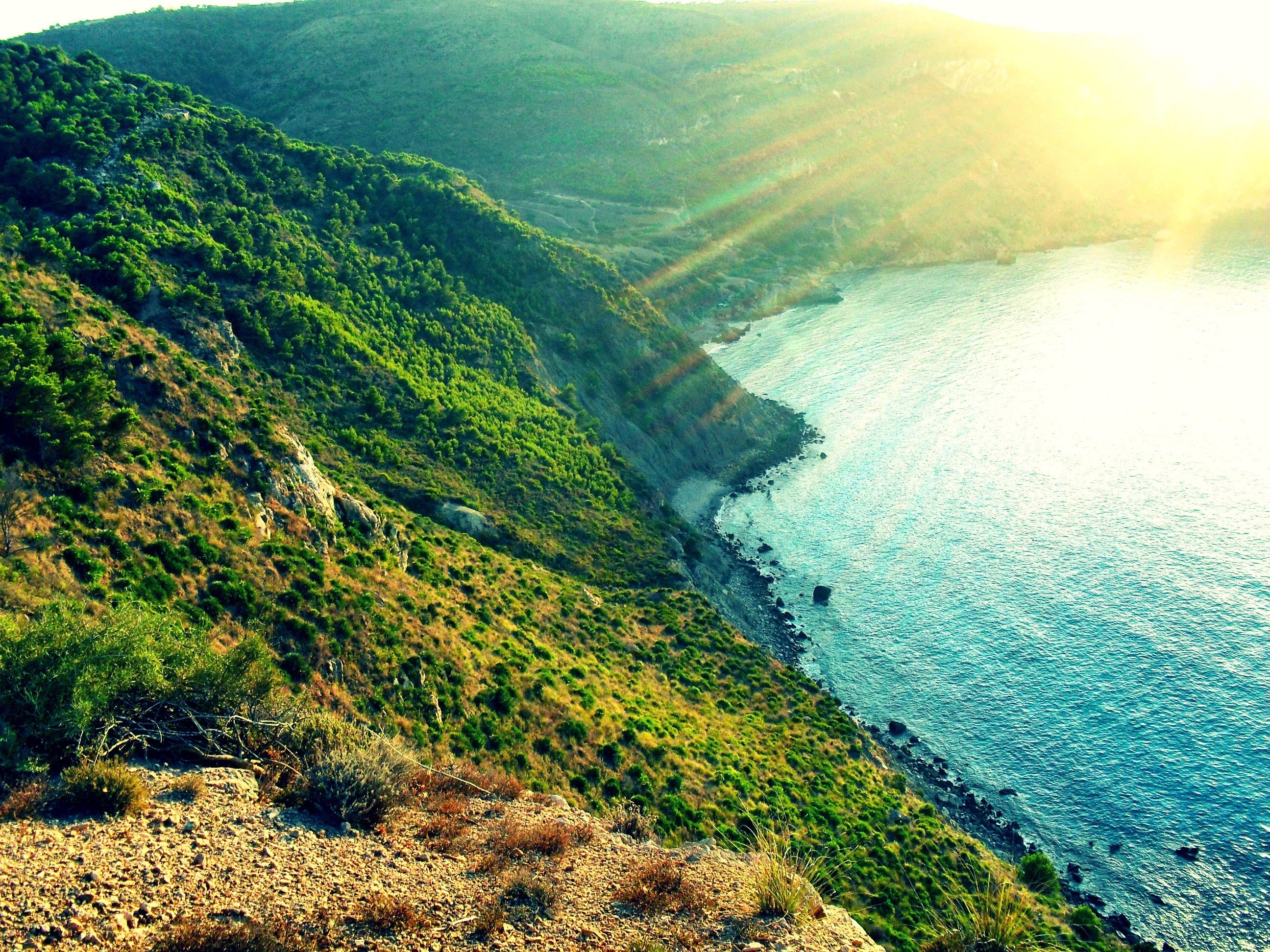 Sunset over coastal hills