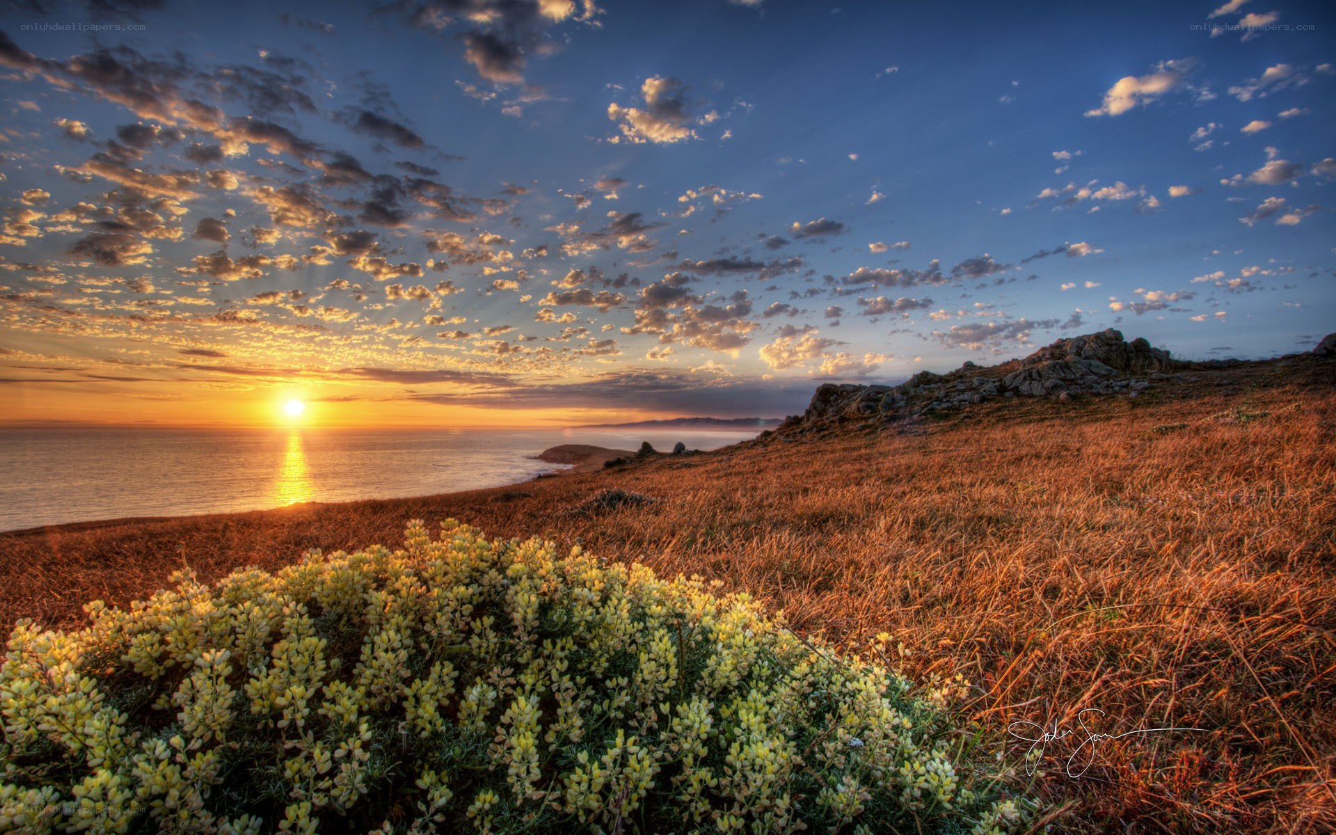 Sunset over coastal hills