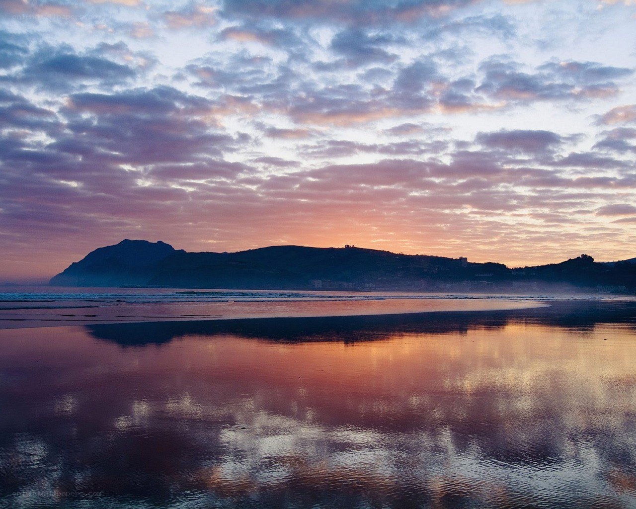 Sunset over coastal hills