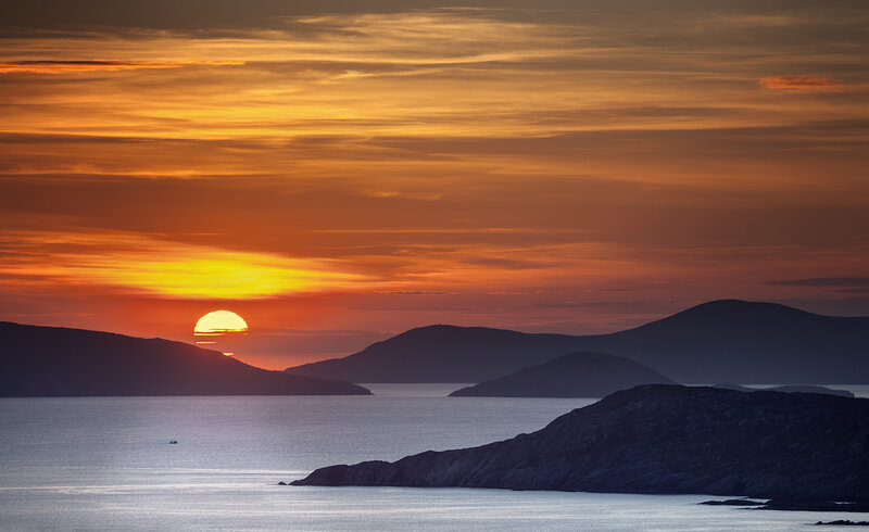 Sunset over Coastal Hills — Orange