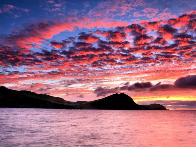 Sunset over Coastal Hills — Red, Dramatic, Photograph, Clouds