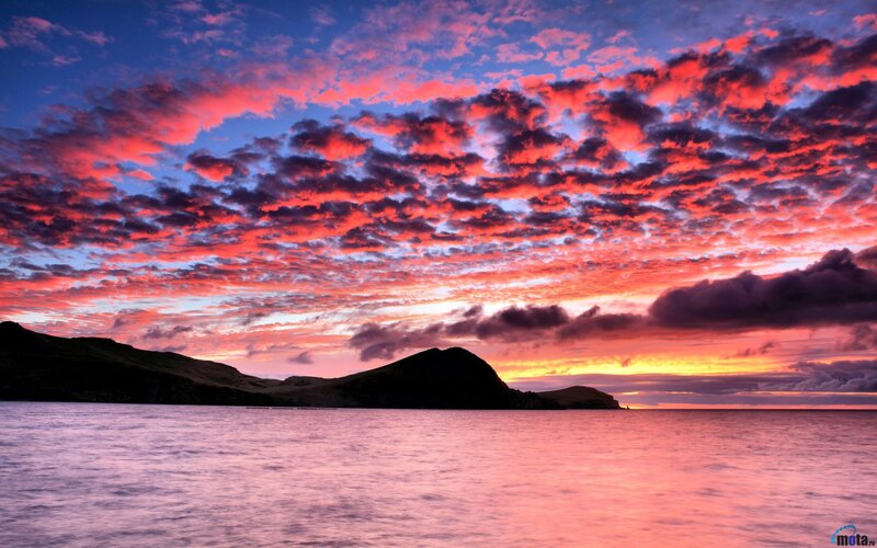 Sunset over Coastal Hills — Red, Dramatic, Photograph, Sea, Clouds