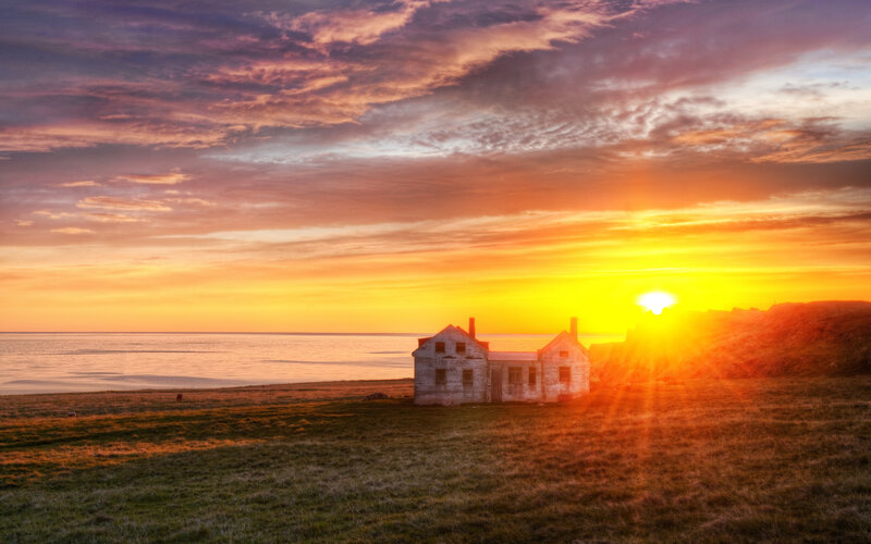 Sunset over coastal house
