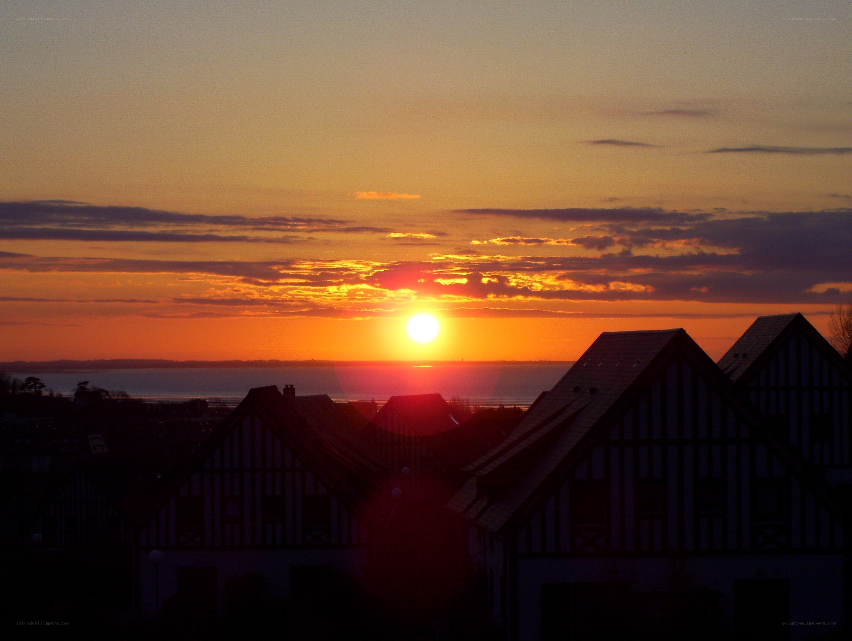 sunset over coastal houses