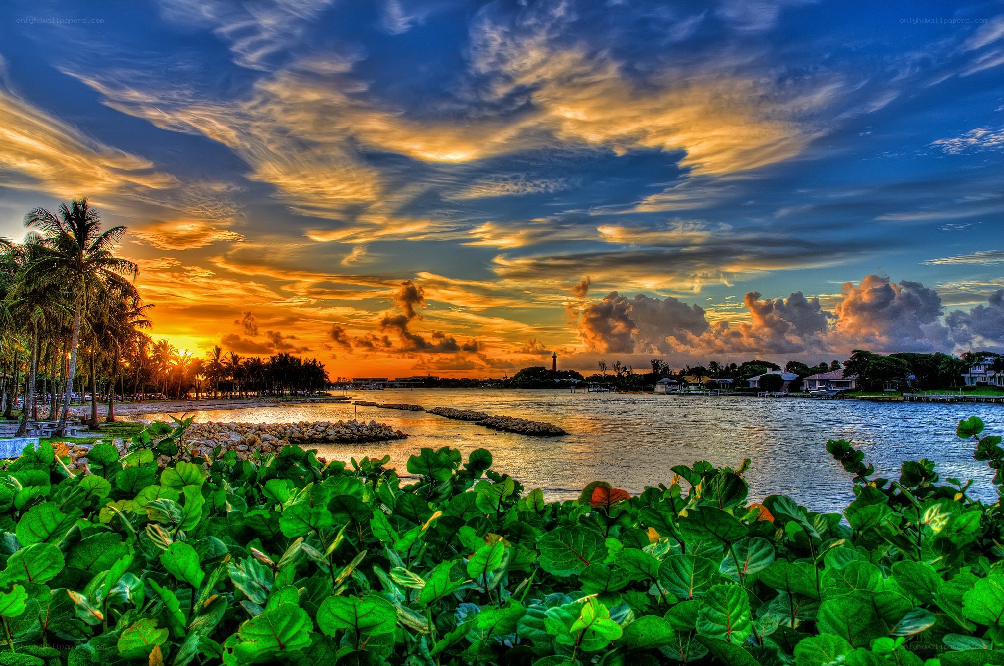 sunset over coastal inlet