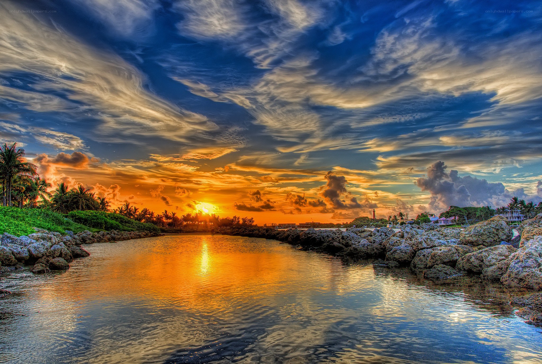 sunset over coastal inlet