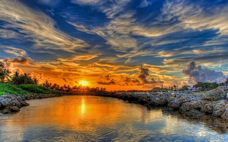 Sunset over Coastal Inlet — Orange, Dramatic, Photograph, Palm Trees, Rocks