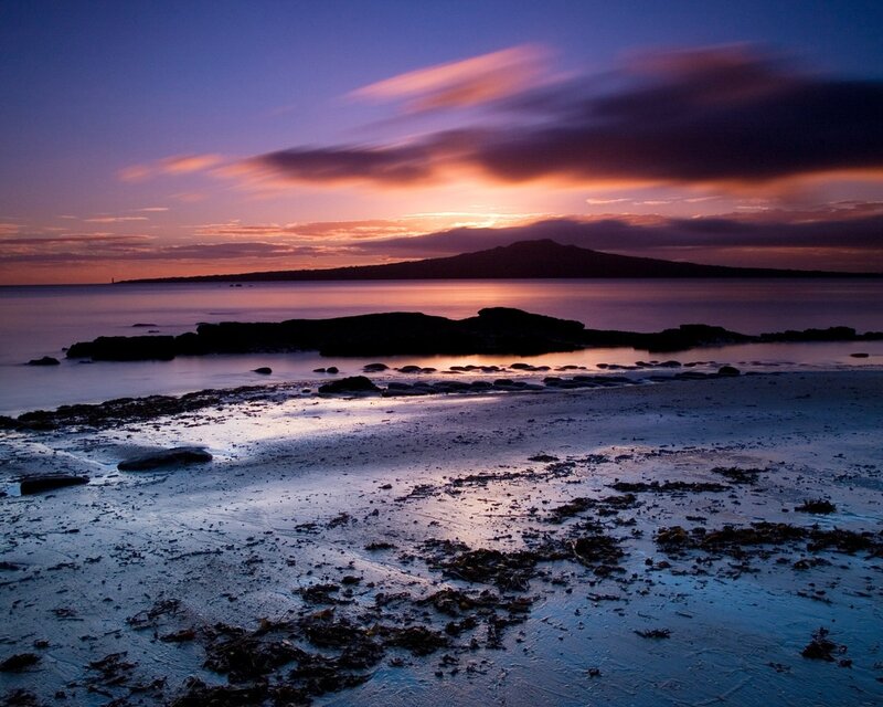 Sunset over coastal island