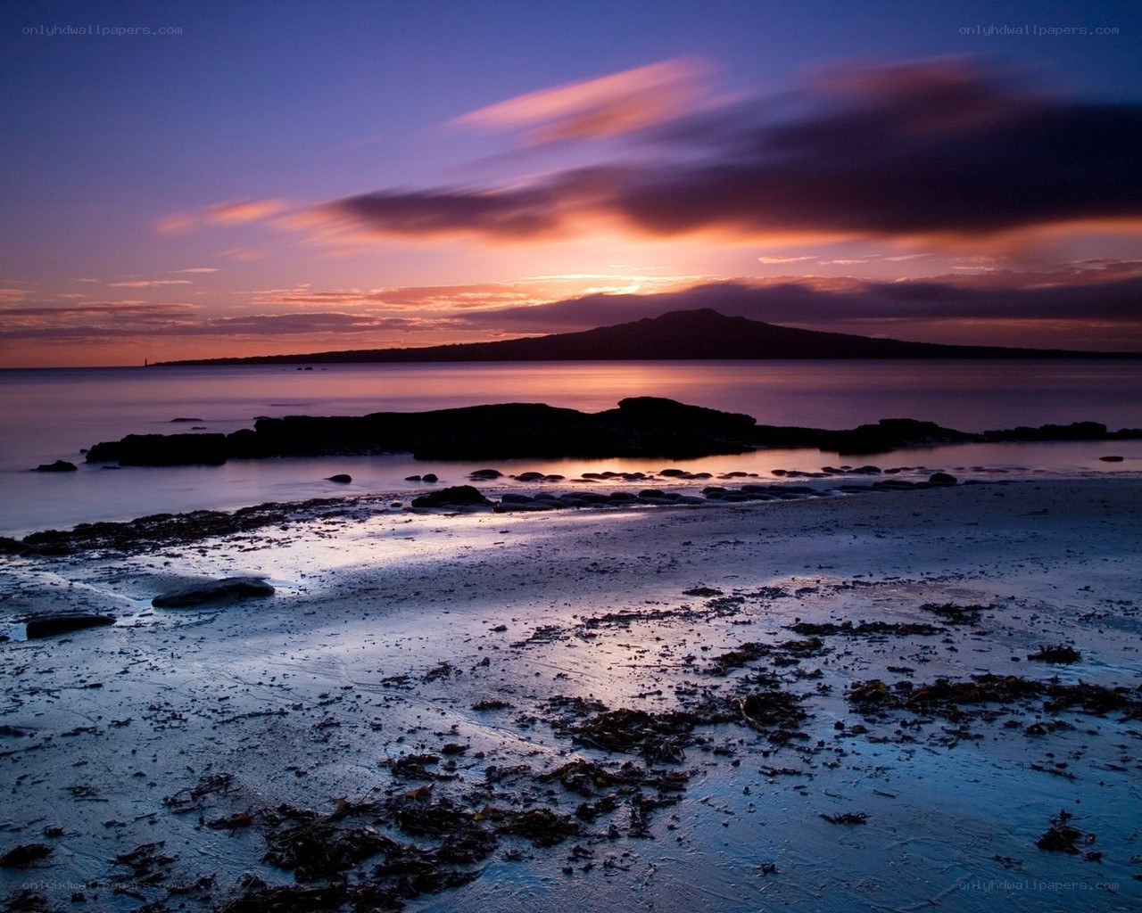 Sunset over coastal island