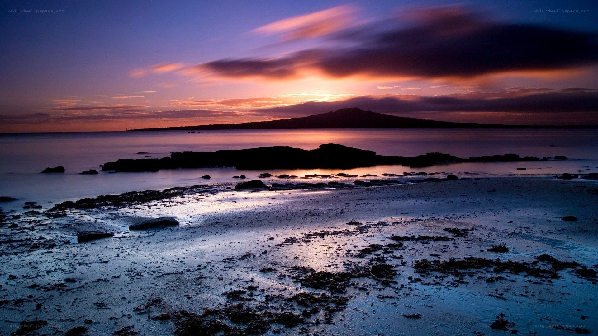 sunset over coastal landscape