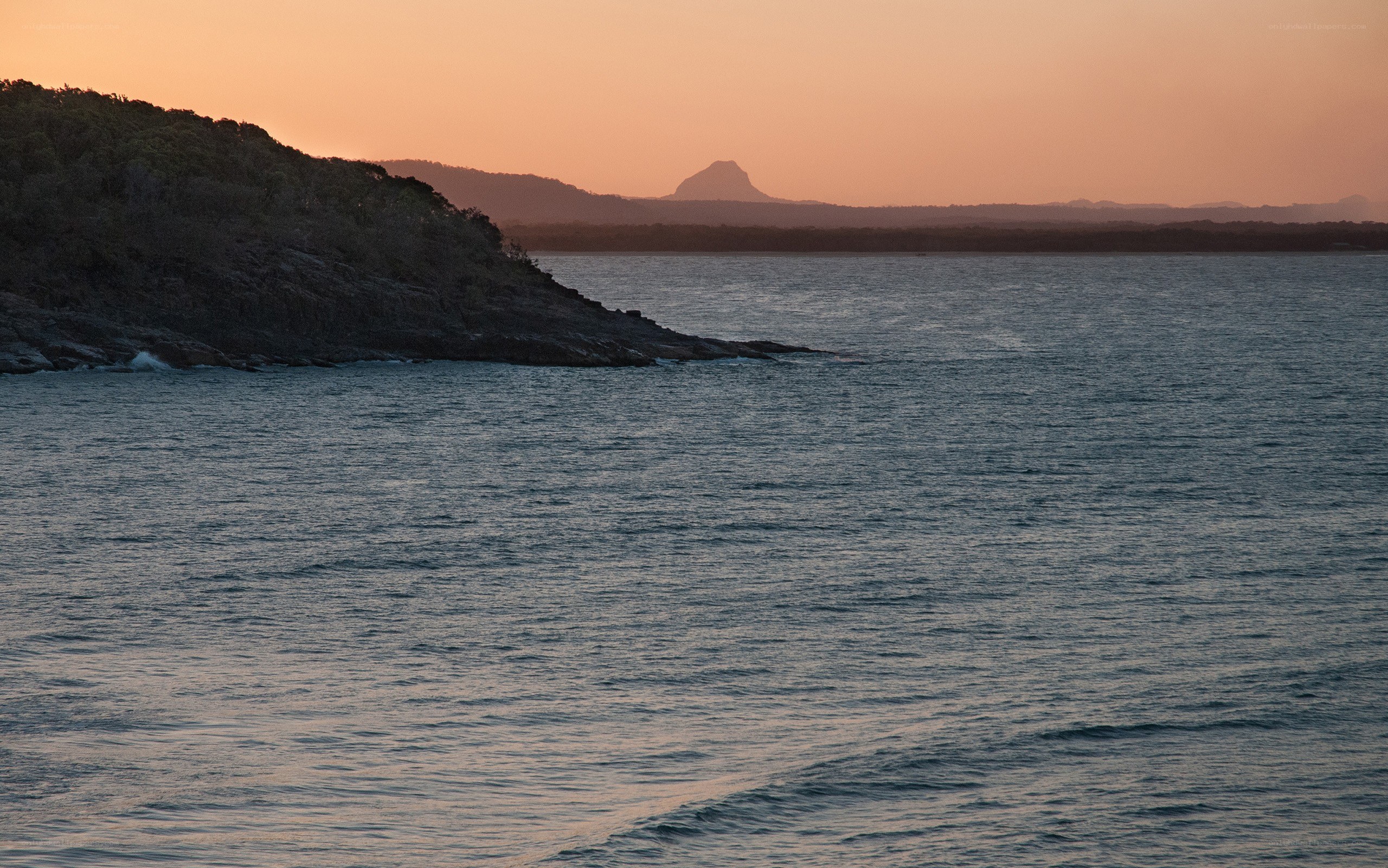 sunset over coastal landscape