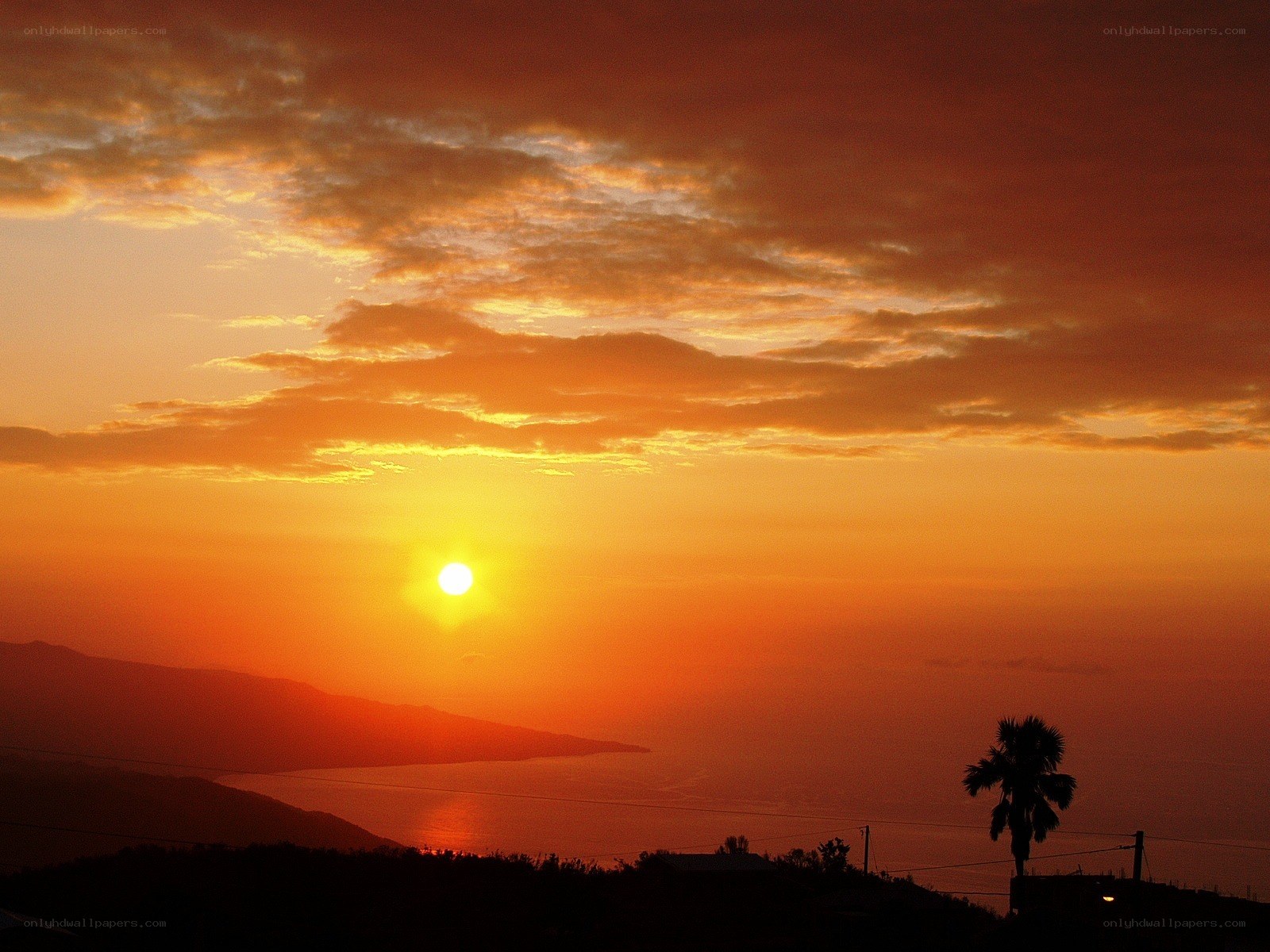 sunset over coastal landscape