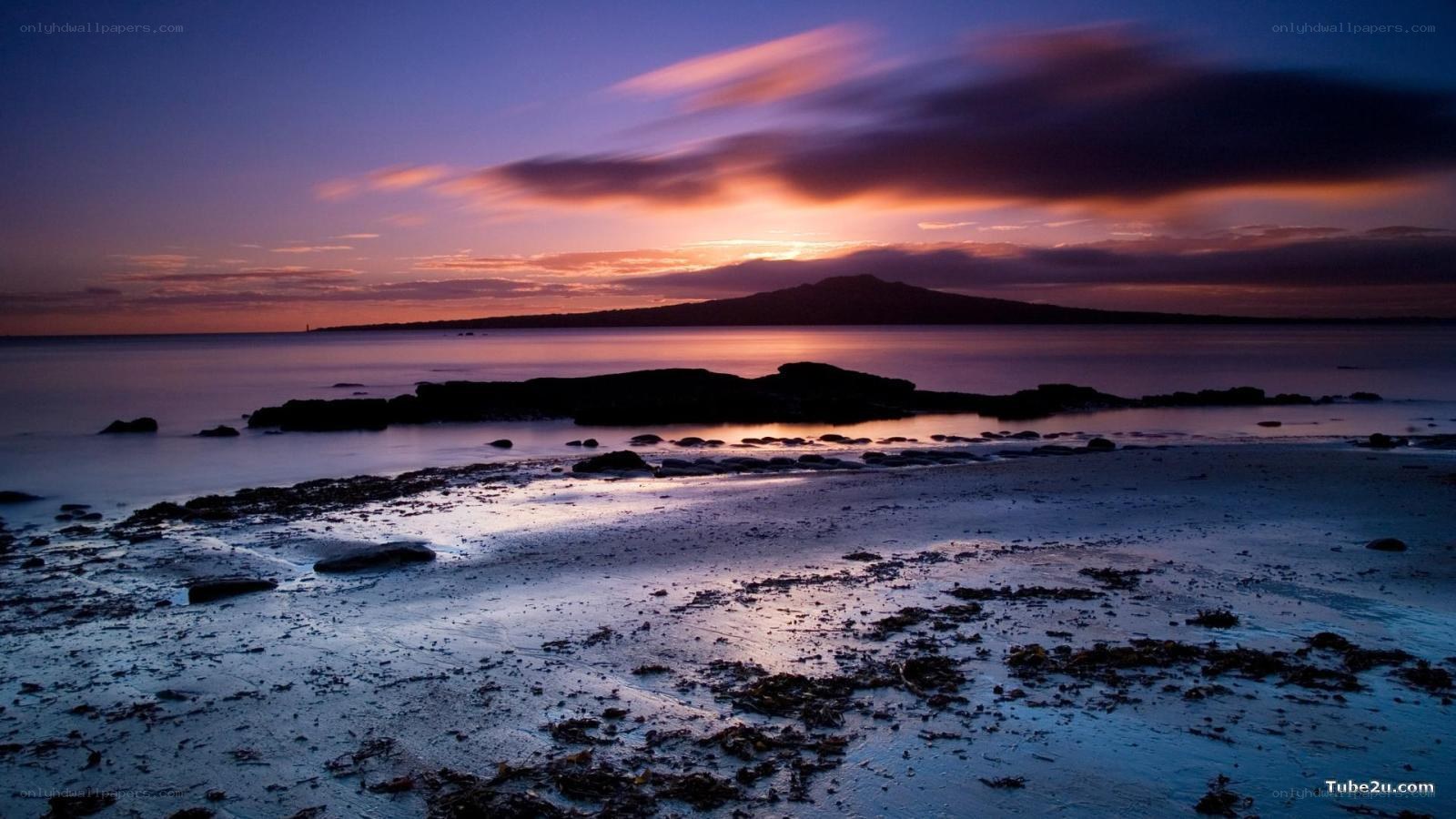 sunset over coastal landscape