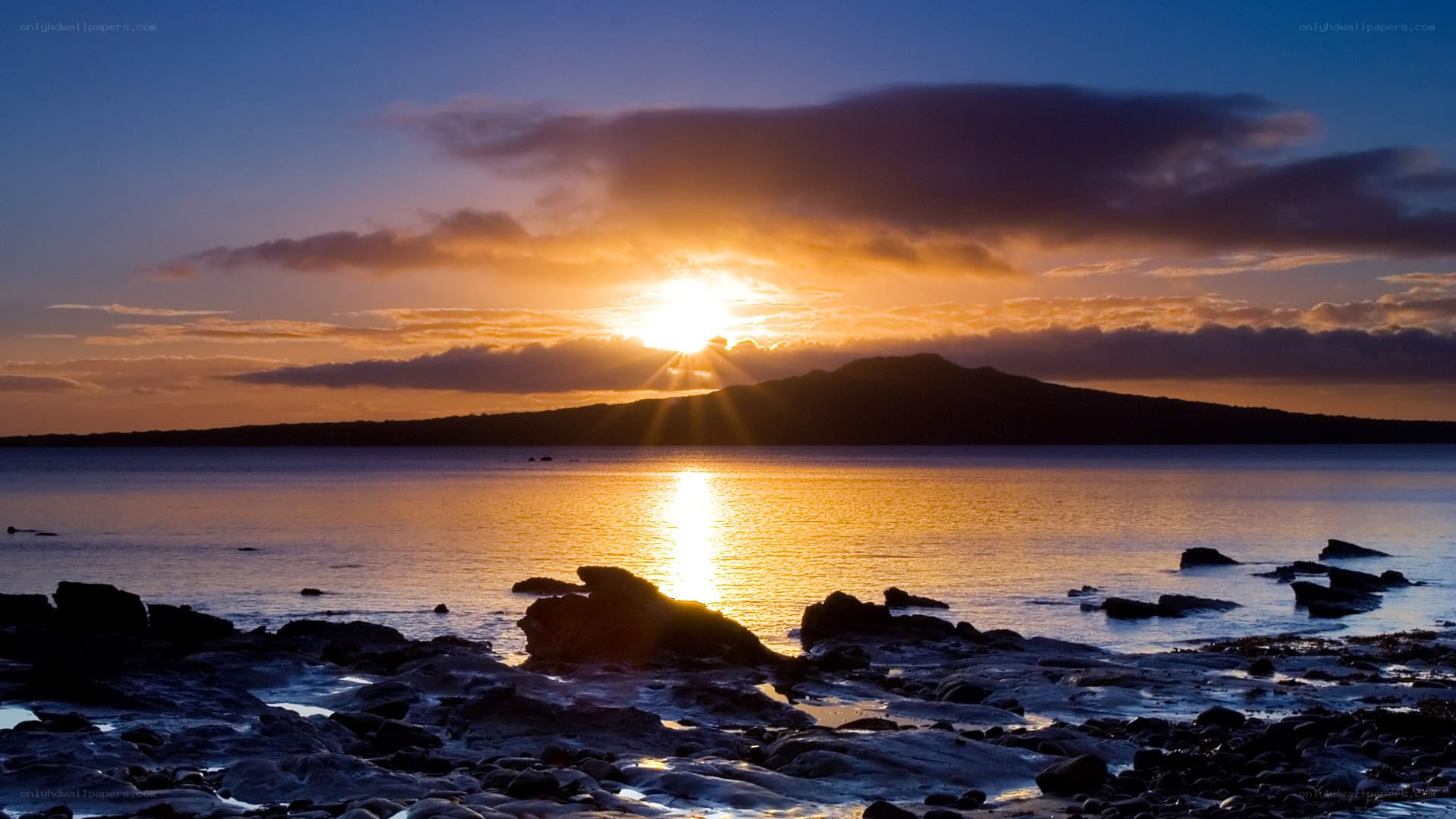 sunset over coastal landscape