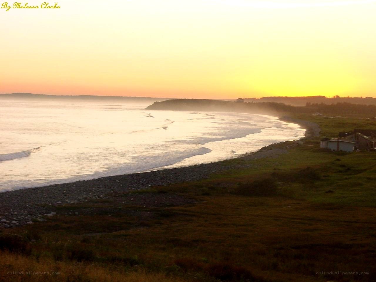sunset over coastal landscape