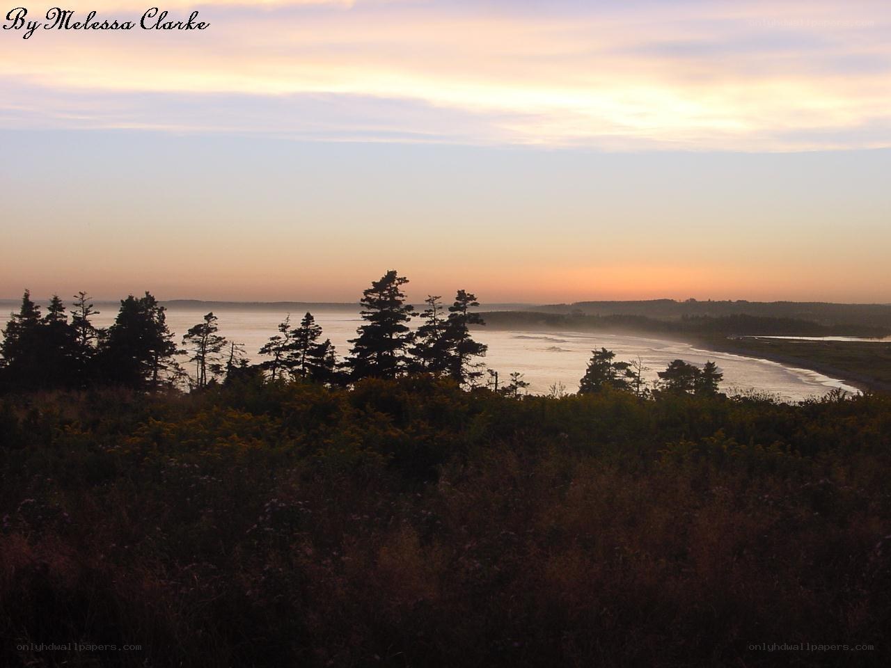 sunset over coastal landscape